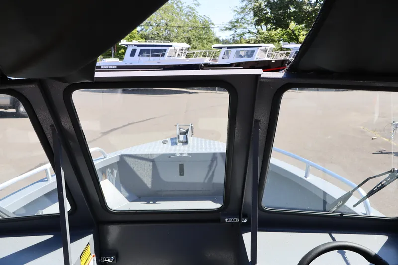Slide: The Image of Interior view of 2026 Alumaweld Talon 18 boat, showcasing windshield and dashboard. - 24