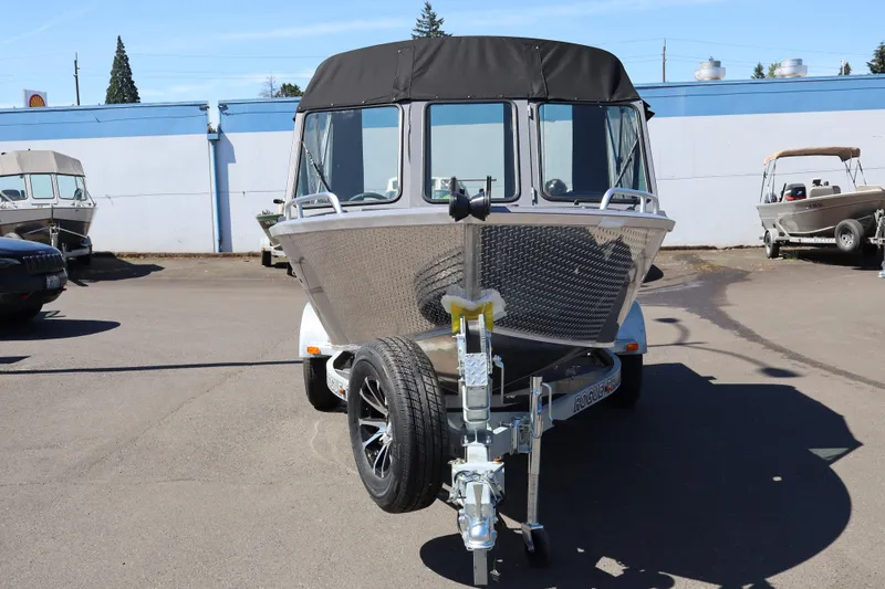 Slide: The Image of 2026 Alumaweld Talon 18 boat on trailer, parked outdoors. - 3