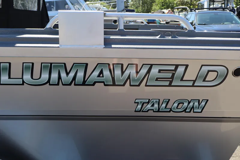 Slide: The Image of 2026 Alumaweld Talon 18 boat side view with logo in sunlight. - 5