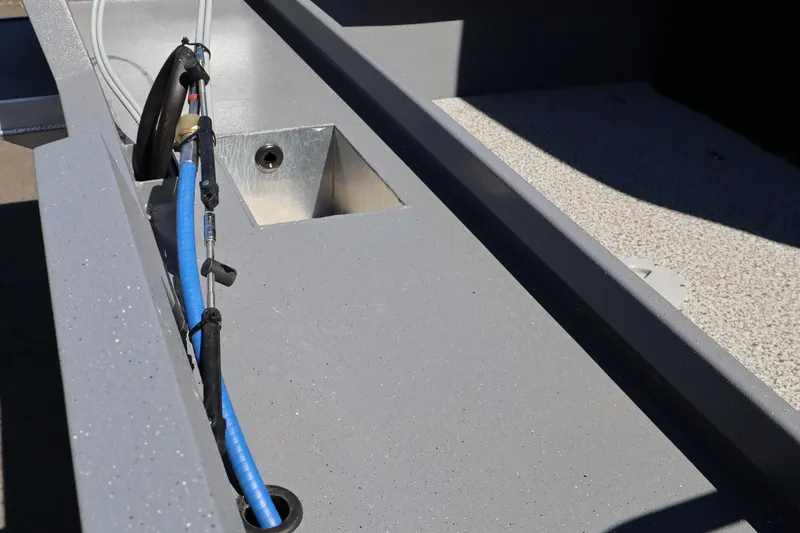Slide: The Image of 2026 Alumaweld Talon 18 boat interior with wiring and storage compartment. - 6