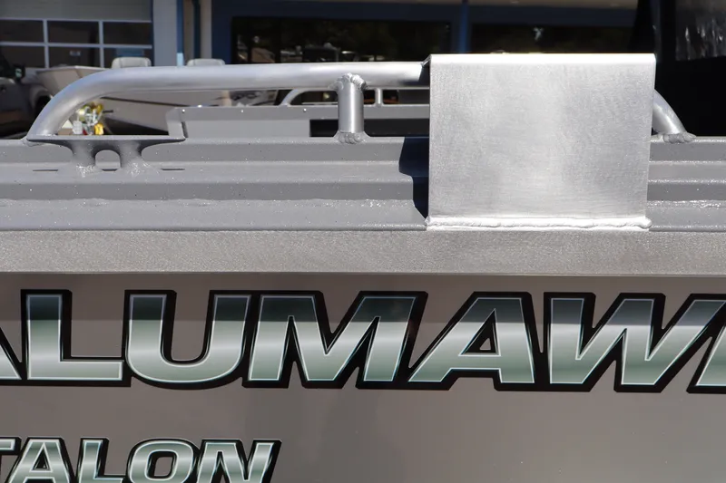 Slide: The Image of 2026 Alumaweld Talon 18 boat detail with metallic finish and branding. - 7