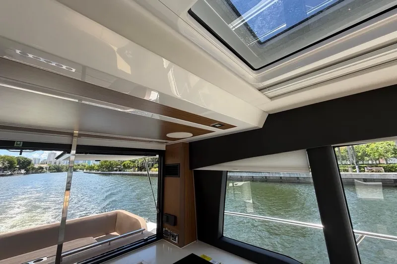 Slide: The Image of Interior view of 2022 Sealine C430 yacht with skylight and waterfront scenery. - 101