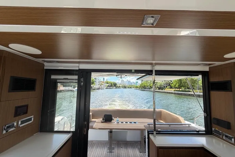 Slide: The Image of Interior view of 2022 Sealine C430 yacht with scenic waterway backdrop. - 102