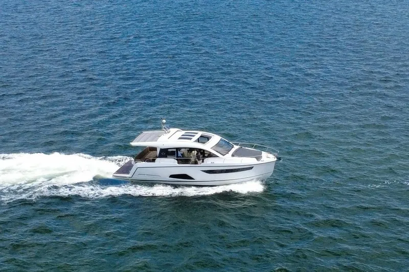Slide: The Image of 2022 Sealine C430 yacht cruising on open water. - 11