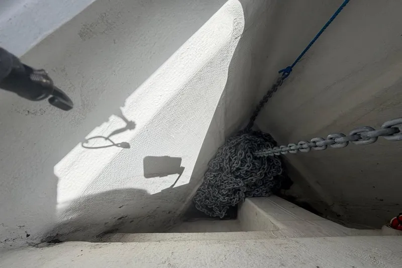 Slide: The Image of Anchor chain storage on 2022 Sealine C430 yacht, featuring neatly coiled chains and ropes. - 20