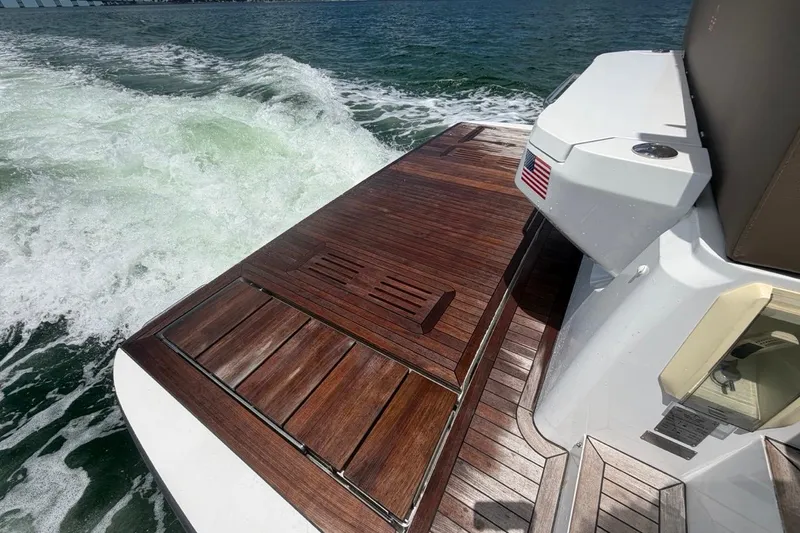 Slide: The Image of 2022 Sealine C430 yacht with teak deck cruising on open water. - 30