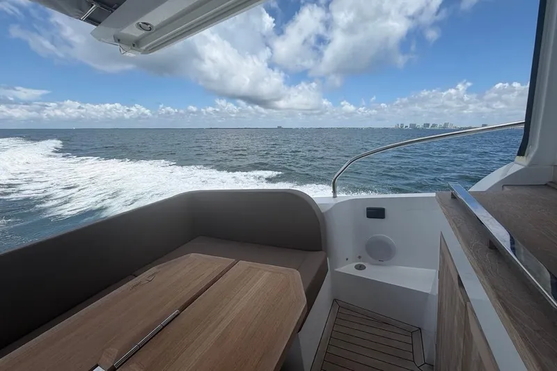 Slide: The Image of 2022 Sealine C430 yacht cruising on open water under a clear blue sky. - 38
