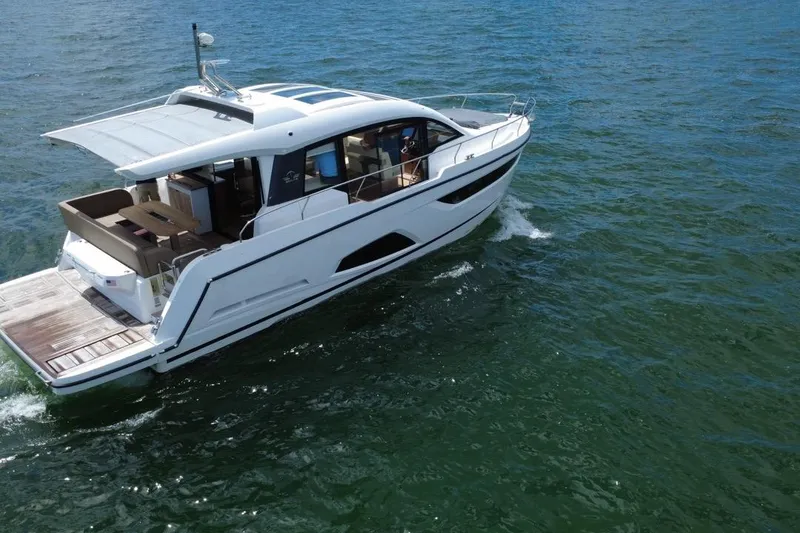 Slide: The Image of 2022 Sealine C430 yacht cruising on open water, showcasing sleek design and luxury features. - 4