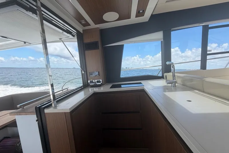 Slide: The Image of Luxurious 2022 Sealine C430 yacht interior with modern kitchen and ocean view. - 41