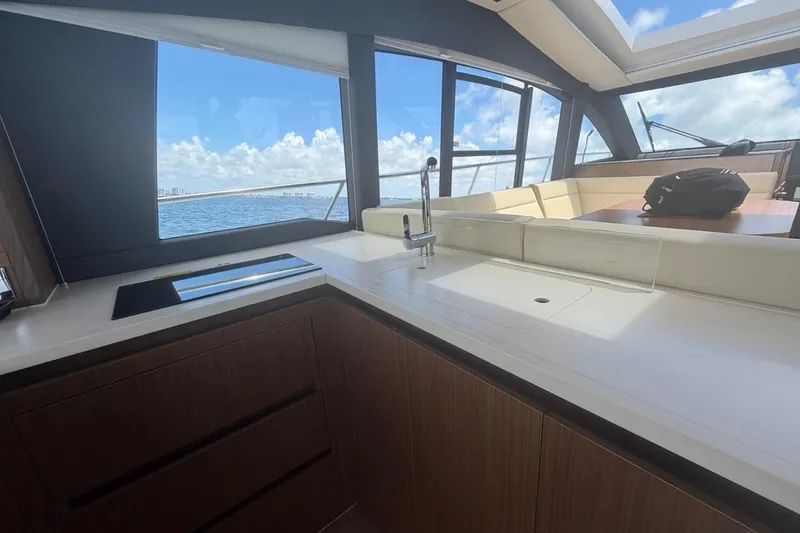 Slide: The Image of Interior of 2022 Sealine C430 yacht with modern kitchen and ocean view. - 42