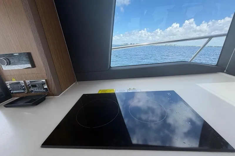 Slide: The Image of Modern kitchen on 2022 Sealine C430 yacht with ocean view through window. - 43
