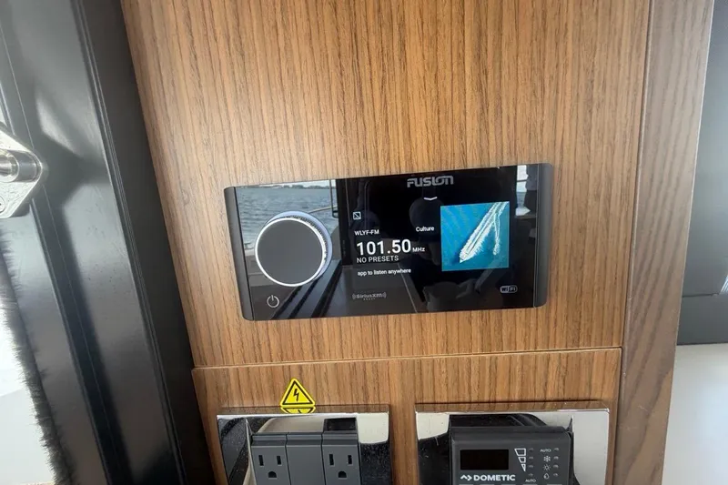 Slide: The Image of Fusion audio system on 2022 Sealine C430 yacht, displaying 101.50 MHz frequency. - 44