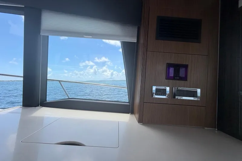 Slide: The Image of Interior view of 2022 Sealine C430 yacht with ocean backdrop through window. - 48