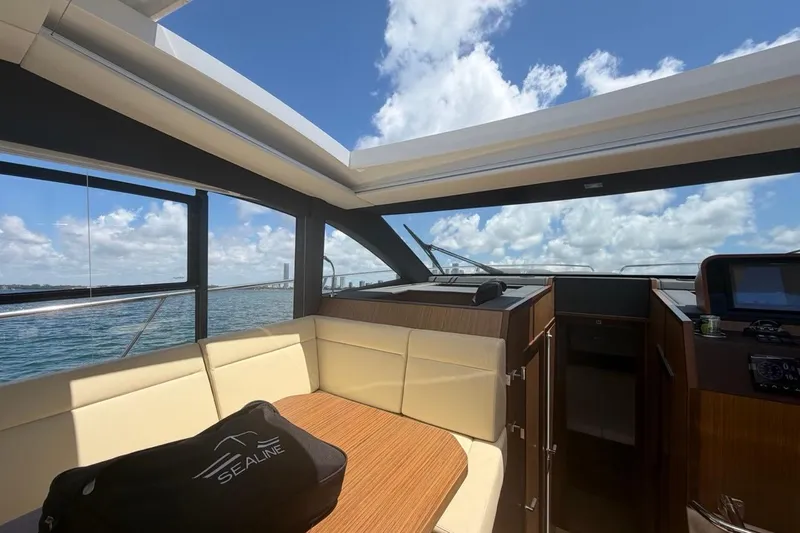 Slide: The Image of Interior of 2022 Sealine C430 yacht with panoramic windows and luxurious seating. - 53