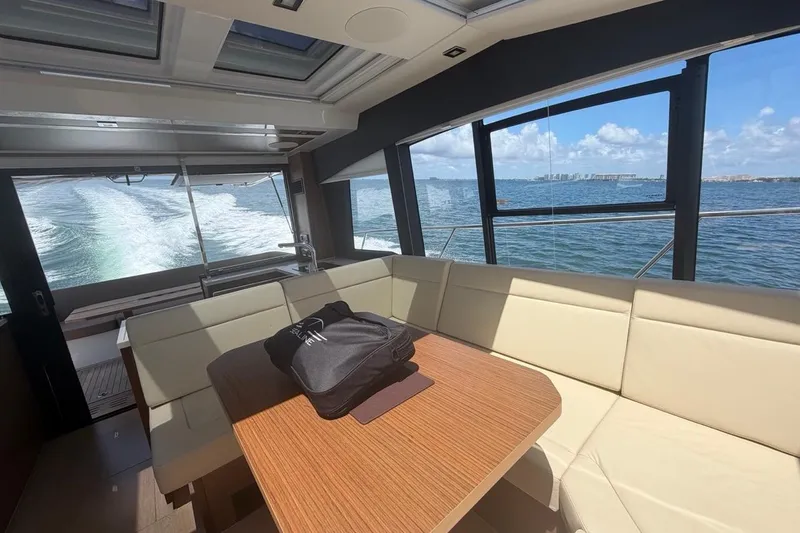 Slide: The Image of Interior of 2022 Sealine C430 yacht with ocean view through large windows. - 55
