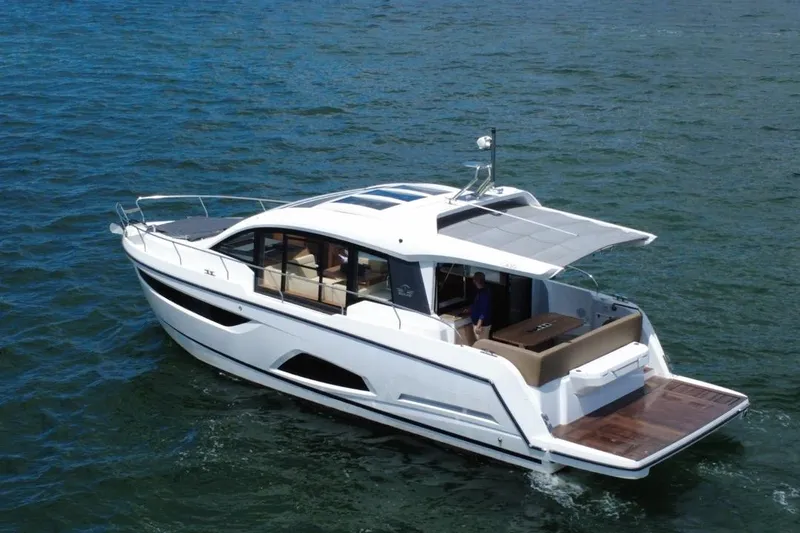 Slide: The Image of 2022 Sealine C430 yacht cruising on open water, showcasing sleek design and spacious deck. - 6