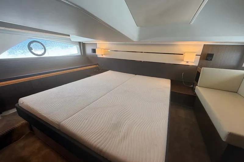 Slide: The Image of Luxurious cabin interior of 2022 Sealine C430 yacht with modern bedding and ambient lighting. - 71