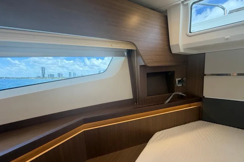 Slide: The Image of Interior of 2022 Sealine C430 yacht cabin with ocean view through window. - 79