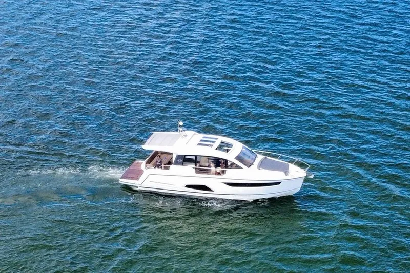 Slide: The Image of 2022 Sealine C430 yacht cruising on open water, showcasing sleek design and luxury. - 8