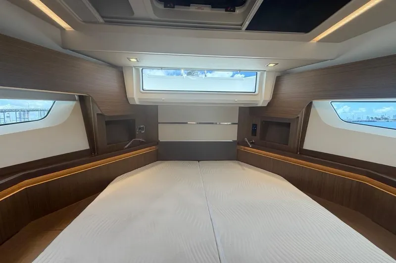 Slide: The Image of Luxurious interior of 2022 Sealine C430 yacht with modern wood finish and large windows. - 80