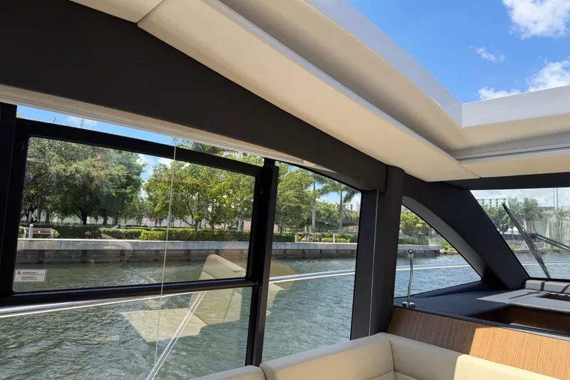 Slide: The Image of Interior view of 2022 Sealine C430 yacht with large windows and scenic waterway. - 97