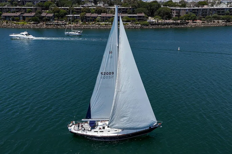 Slide: The Image of Sailing yacht Hinckley Sou'wester 52, 1998 model, cruising on calm waters. - 11