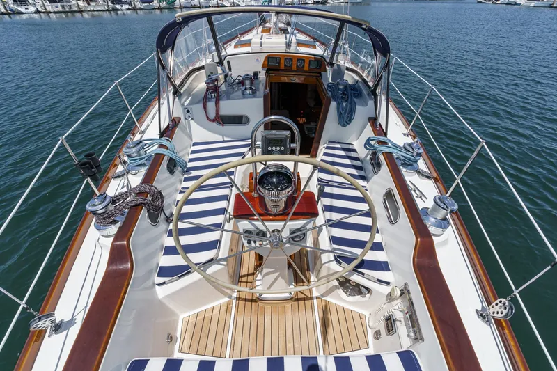 Slide: The Image of Hinckley Sou'wester 52 yacht cockpit, 1998 model, with striped seating and wooden accents. - 19