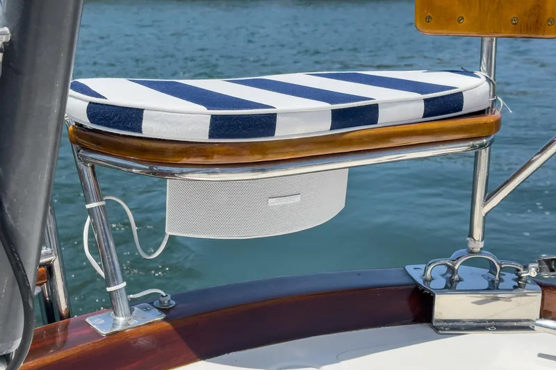 Slide: The Image of Cushioned seat on 1998 Hinckley Sou'wester 52 yacht, featuring blue and white stripes. - 32