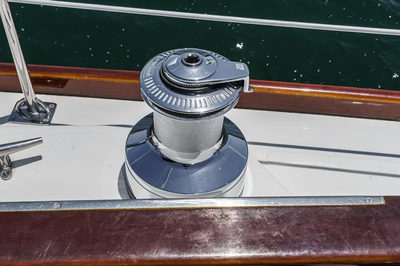Slide: The Image of Winch on 1998 Hinckley Sou'wester 52 sailboat deck, with polished wood trim. - 33