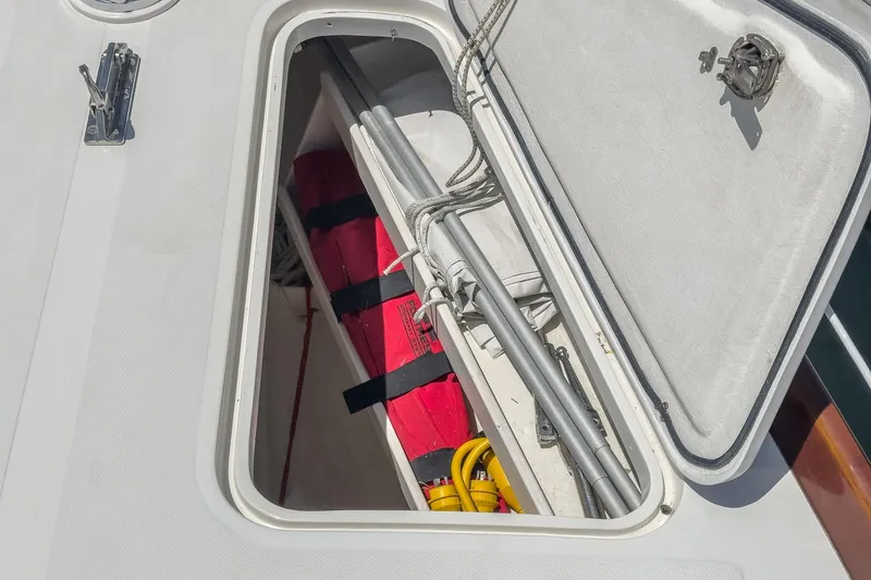 Slide: The Image of Open storage compartment on 1998 Hinckley Sou'wester 52 sailboat deck. - 40