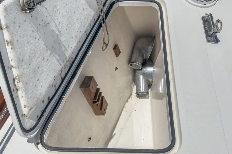 Slide: The Image of Open hatch on 1998 Hinckley Sou'wester 52, showing storage compartment with metal pipes. - 41
