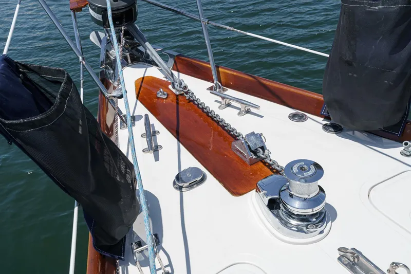 Slide: The Image of Deck of 1998 Hinckley Sou'wester 52 sailboat with anchor chain and winch. - 42