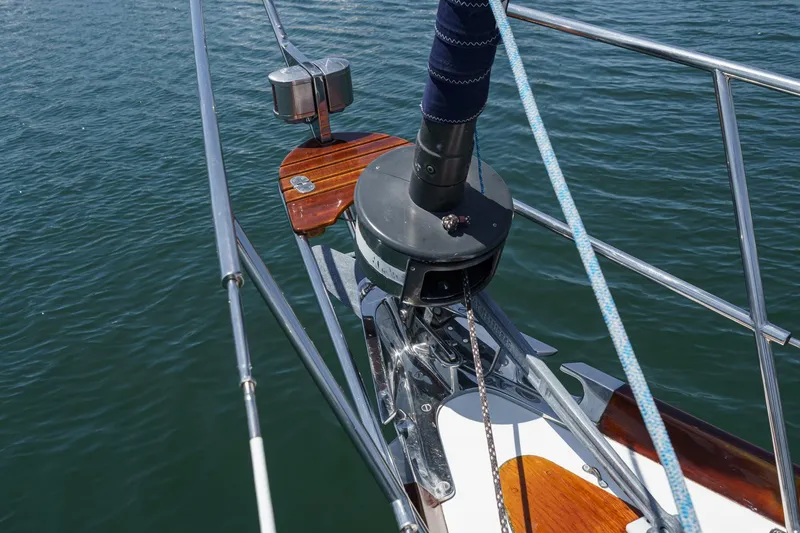 Slide: The Image of Bow of 1998 Hinckley Sou'wester 52 sailboat with polished metal and wood details. - 43