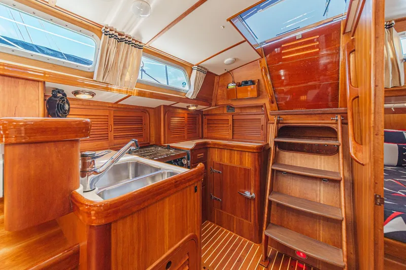 Slide: The Image of Luxurious wooden interior of 1998 Hinckley Sou'wester 52 yacht kitchen area. - 45