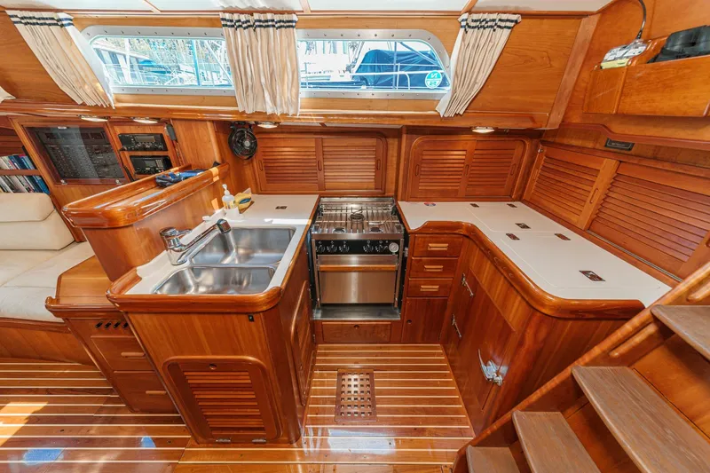 Slide: The Image of Luxurious wooden interior of 1998 Hinckley Sou'wester 52 yacht kitchen area. - 47