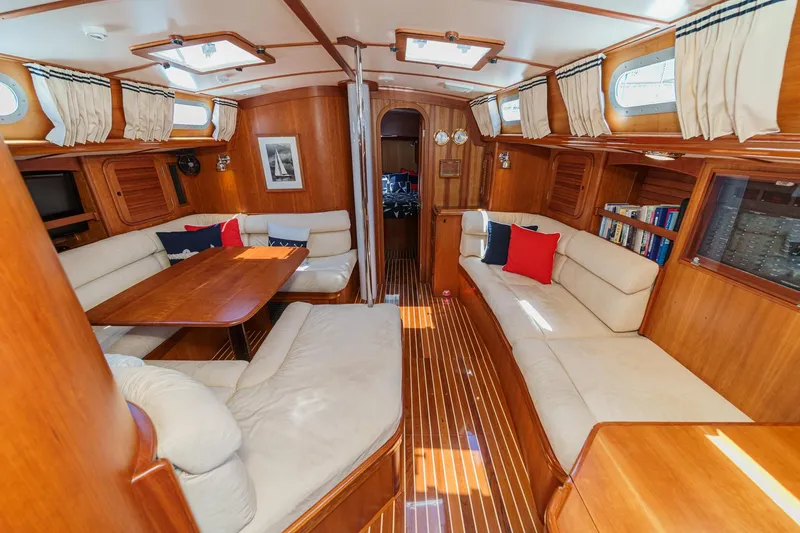 Slide: The Image of Luxurious interior of a 1998 Hinckley Sou'wester 52 yacht with elegant wood finishes. - 52