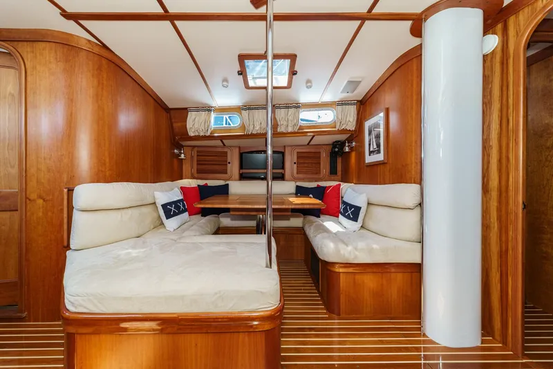 Slide: The Image of Luxurious interior of 1998 Hinckley Sou'wester 52 yacht with wooden finish and plush seating. - 55