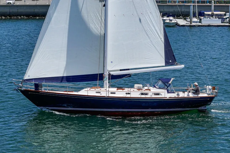 Slide: The Image of Sailing yacht Hinckley Sou'wester 52, 1998 model, cruising on blue water. - 6