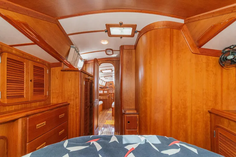 Slide: The Image of Interior of 1998 Hinckley Sou'wester 52 yacht with elegant wooden cabinetry and cozy design. - 66