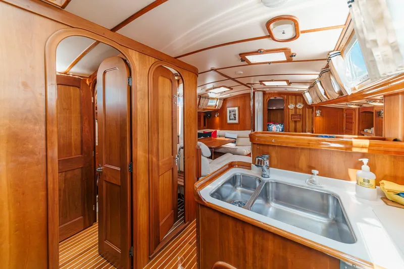 Slide: The Image of Interior of 1998 Hinckley Sou'wester 52 yacht with wooden finish and modern amenities. - 71