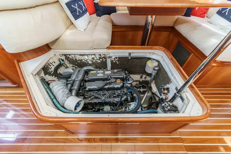 Slide: The Image of Engine compartment of a 1998 Hinckley Sou'wester 52 yacht, showcasing detailed interior design. - 78