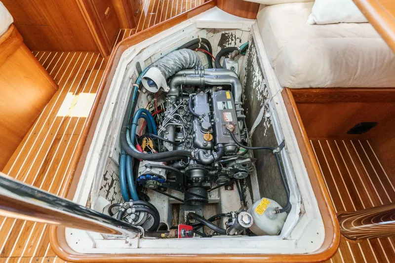 Slide: The Image of Engine compartment of 1998 Hinckley Sou'wester 52 sailboat, showcasing detailed mechanical components. - 79