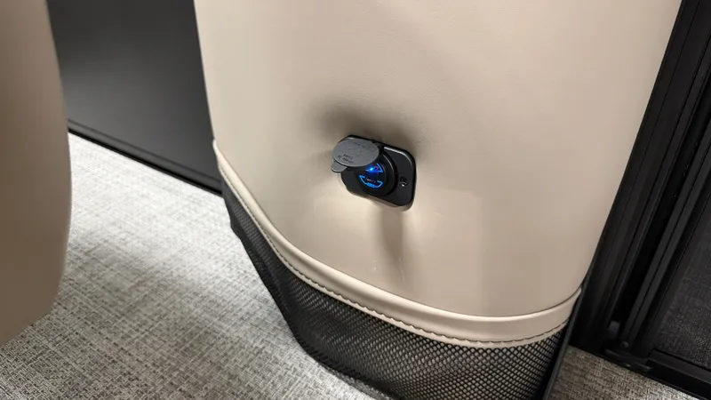 Slide: The Image of A USB charging port is integrated into the interior paneling of a boat. - 34