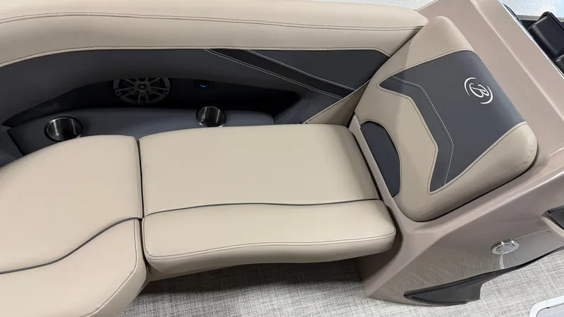 Slide: The Image of The 2027 Barletta ARIA22UC features luxurious beige upholstery with black accents and built-in cup holders. - 17