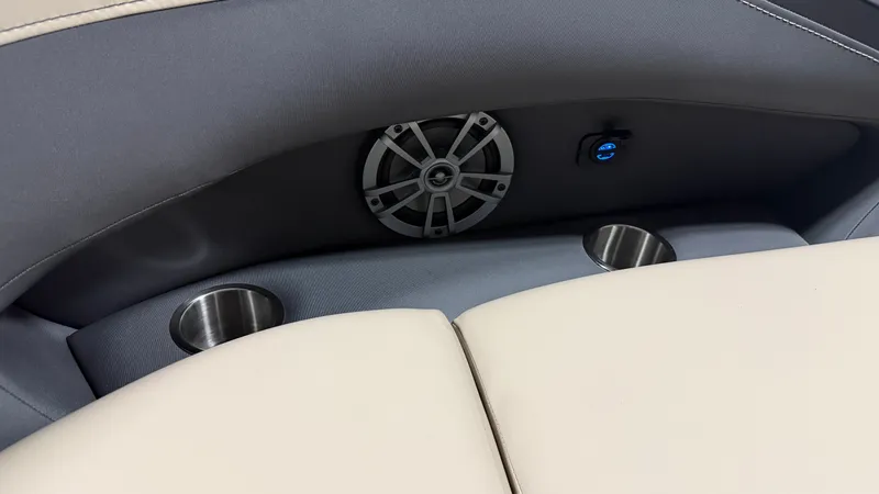 Slide: The Image of Close-up of a boat seat with speaker, USB port, and cup holders. - 15