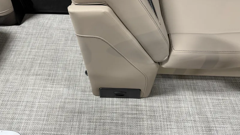 Slide: The Image of Close-up of a beige seat with sleek stitching on a textured carpeted floor. - 29