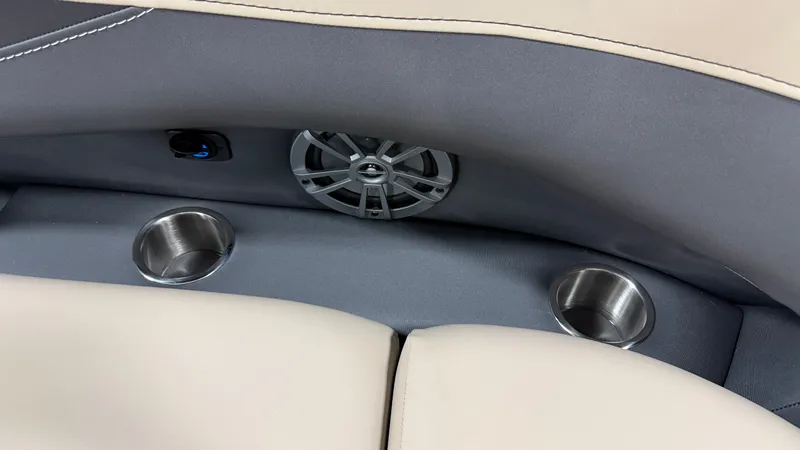Slide: The Image of Close-up of a boat seat with a speaker and cup holders. - 24