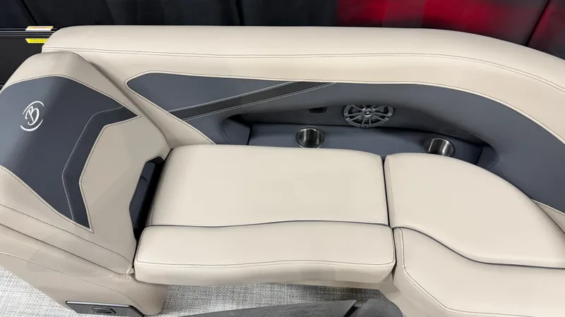 Slide: The Image of The 2027 Barletta ARIA22UC features sleek, cream-colored upholstery with integrated cup holders. - 23