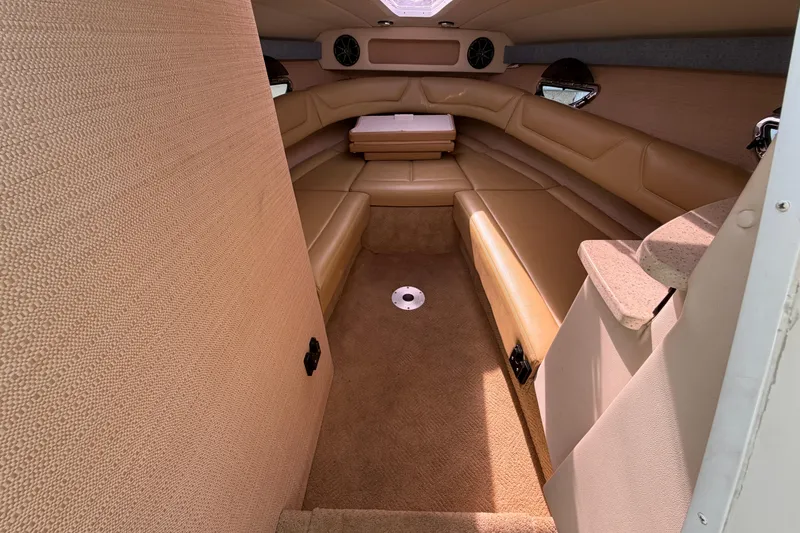 Slide: The Image of Interior of 2013 Cobalt 273 boat with beige seating and carpet. - 12