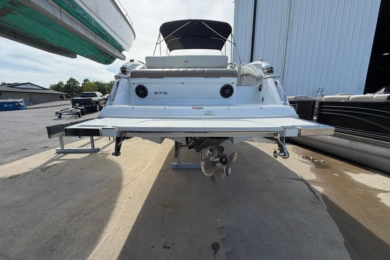 Slide: The Image of Rear view of a 2013 Cobalt 273 boat with propeller and swim platform. - 2